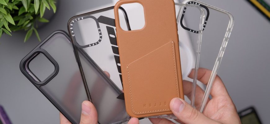 person holding orange leather smartphone case