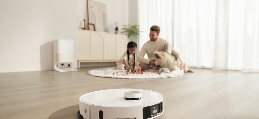 Robot vacuum cleans floor while family relaxes