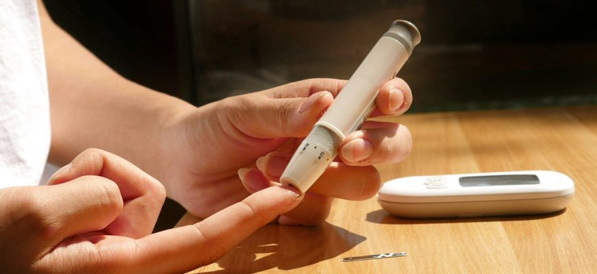 a person sitting at a table with a cell phone
