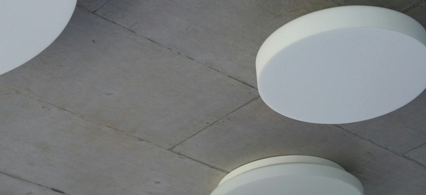 two round white plates on floor